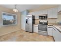 Bright kitchen features stainless steel appliances and tile flooring at 7201 29Th Avenue W Dr # 309, Bradenton, FL 34209