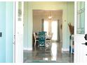 Bright entryway with view into dining room and high ceilings at 716 Laurel Ave, Venice, FL 34285