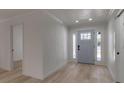 Light and bright entryway with hardwood floors and a view of a modern door at 2303 89Th Nw St, Bradenton, FL 34209
