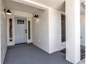 Newly renovated home with a light gray front door and tiled flooring at 2303 89Th Nw St, Bradenton, FL 34209