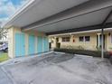 Covered parking area with storage units at 2465 Northside Dr # 906, Clearwater, FL 33761