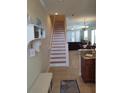 Staircase leading to the second floor and living area at 11776 Angler'S Club Dr, Placida, FL 33946