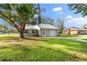 Newly built home with a metal roof and a spacious yard at 2382 Spring Oaks Ct, Sarasota, FL 34234