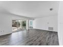 Spacious living room with sliding glass doors to backyard at 2420 Sunnyside St, Sarasota, FL 34239