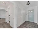 Bright and airy entryway with light wood floors at 2420 Sunnyside St, Sarasota, FL 34239