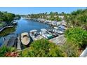 Waterfront community with boat slips and lush tropical landscaping at 2609 Riverbluff Pkwy # 146, Sarasota, FL 34231