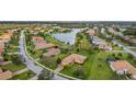 Beautiful neighborhood with winding streets and scenic lake views; enjoy peaceful community living at 409 147Th Ne Ct, Bradenton, FL 34212