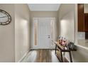 Inviting entryway with wood-look tile flooring and neutral paint palette; bright and welcoming at 409 147Th Ne Ct, Bradenton, FL 34212