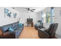 Bright living room featuring hardwood floors and comfy seating at 1105 58Th S St, Gulfport, FL 33707