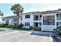 Charming condo building with ample parking and lush landscaping at 1100 Capri Isles Blvd # 523, Venice, FL 34292