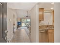 Bright and spacious entryway leading to the living room and kitchen at 1100 Capri Isles Blvd # 523, Venice, FL 34292