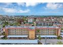 Aerial view of condo building with parking and surrounding area at 1215 S Portofino Dr # 404, Sarasota, FL 34242