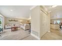 Bright living room with tiled floors and neutral-toned furniture at 134 Da Vinci Dr, Nokomis, FL 34275