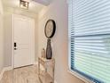 Bright entryway with a console table and large window at 14132 Campfire Ct, Parrish, FL 34219