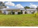 Ranch-style home with metal roof and large yard at 38603 Taylor Rd, Myakka City, FL 34251