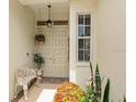 Inviting entryway with double doors and a bench at 4561 Murcia Blvd # 13, Sarasota, FL 34238