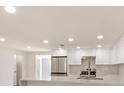 Spacious kitchen featuring stainless steel appliances and white shaker cabinets at 5321 13Th Avenue W Dr, Bradenton, FL 34209