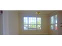 Bright dining area with large windows and neutral carpeting at 5701 Soldier Cir # 104, Sarasota, FL 34233