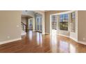 Bright living room with hardwood floors and large windows at 14106 18Th E Pl, Bradenton, FL 34212