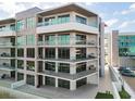 Modern condo building with large balconies and water views at 1591 Gulf Of Mexico Dr # 413, Longboat Key, FL 34228