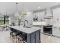 Open concept kitchen with large island and breakfast nook at 16247 Hidden Oak Loop, Bradenton, FL 34211