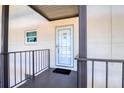 Condo entry with tiled floor and view into kitchen at 4452 Garnet Dr # 205, New Port Richey, FL 34652