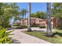 Brick-paved driveway leads to this charming waterfront home at 4511 Bay Shore Rd, Sarasota, FL 34234