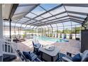 Inviting screened pool area with patio furniture at 608 4Th Sw St, Largo, FL 33770