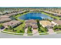 Luxury home on a lake with a two-car garage and a large lot at 6771 Wild Lake Ter, Bradenton, FL 34212