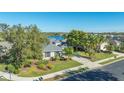 Single-story home exterior, featuring a landscaped yard and lake view at 7407 Sea Island Ln, Bradenton, FL 34201