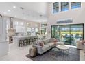 Open living space with high ceilings, pool views, and a large sectional sofa at 7634 Windy Hill Cv, Bradenton, FL 34202