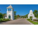 Community entrance with clock tower and signage at 8124 Anthirium Loop, Sarasota, FL 34240