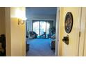 Bright and airy living room with access to a balcony at 99 Vivante Blvd # 99315, Punta Gorda, FL 33950