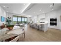 Modern kitchen with white cabinets and marble countertops at 1591 Gulf Of Mexico Dr # 515, Longboat Key, FL 34228