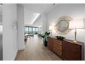 Elegant entryway with mid-century modern console table and mirror at 1591 Gulf Of Mexico Dr # 515, Longboat Key, FL 34228