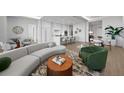 Open concept living area with modern furniture and kitchen at 1591 Gulf Of Mexico Dr # 515, Longboat Key, FL 34228