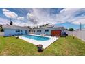 Relaxing rectangular pool in backyard with patio furniture at 20439 Peachland Blvd, Port Charlotte, FL 33954