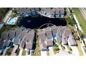 Aerial view showcasing the villa's location near a lake at 508 Woodstork Cir, Bradenton, FL 34209