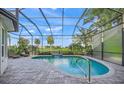 Screened in pool area overlooking the golf course, with plenty of room for lounge chairs at 7139 Sandhills Pl, Lakewood Ranch, FL 34202