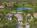 Bird's-eye view of a house in a golf course community at 7139 Sandhills Pl, Lakewood Ranch, FL 34202