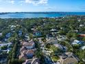 Aerial view of a house and neighborhood near the water at 1827 Morris St, Sarasota, FL 34239