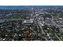 Aerial view of a home encircled in red with a city and water in the background at 217 S Shade Ave, Sarasota, FL 34237