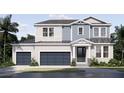 Lovely two-story home features a three-car garage, and meticulous front yard landscaping at 217 S Shade Ave, Sarasota, FL 34237