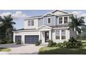 Charming two-story home with a well-manicured lawn, a three-car garage, and a covered entryway at 217 S Shade Ave, Sarasota, FL 34237