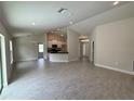 Spacious open floor plan with hard surface floors, modern lighting, and neutral colors throughout at 5605 Gaffney Avenue, North Port, FL 34291