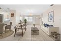 Bright living room with neutral decor, stylish furnishings and an open floorplan at 6352 Coniston Ter, North Port, FL 34287