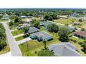 Aerial view of a single-Gathering home and surrounding neighborhood at 7648 Totem Ave, North Port, FL 34291