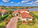 Stunning lakefront property with spacious home at 1509 Raphis Royale Blvd, Englewood, FL 34223