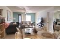 A comfortable living room with neutral-toned furniture, and a television at 1540 Glen Oaks E Dr # B336, Sarasota, FL 34232