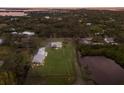 An aerial view of a home with an expansive lawn near a body of water surrounded by trees at 1640 Center Rd # Terra Ceia Island, Palmetto, FL 34221